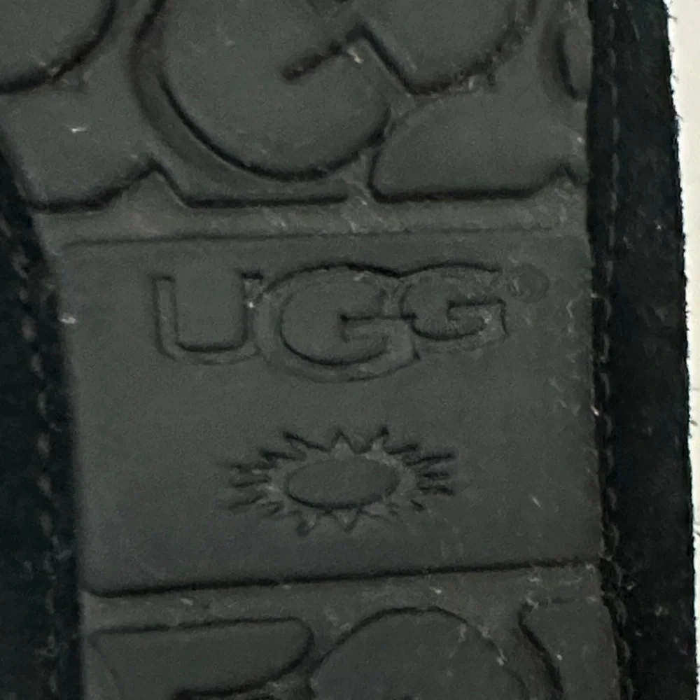UGG Black Starry Moccasins with gray Shearling size 5 girls or 7 women’s